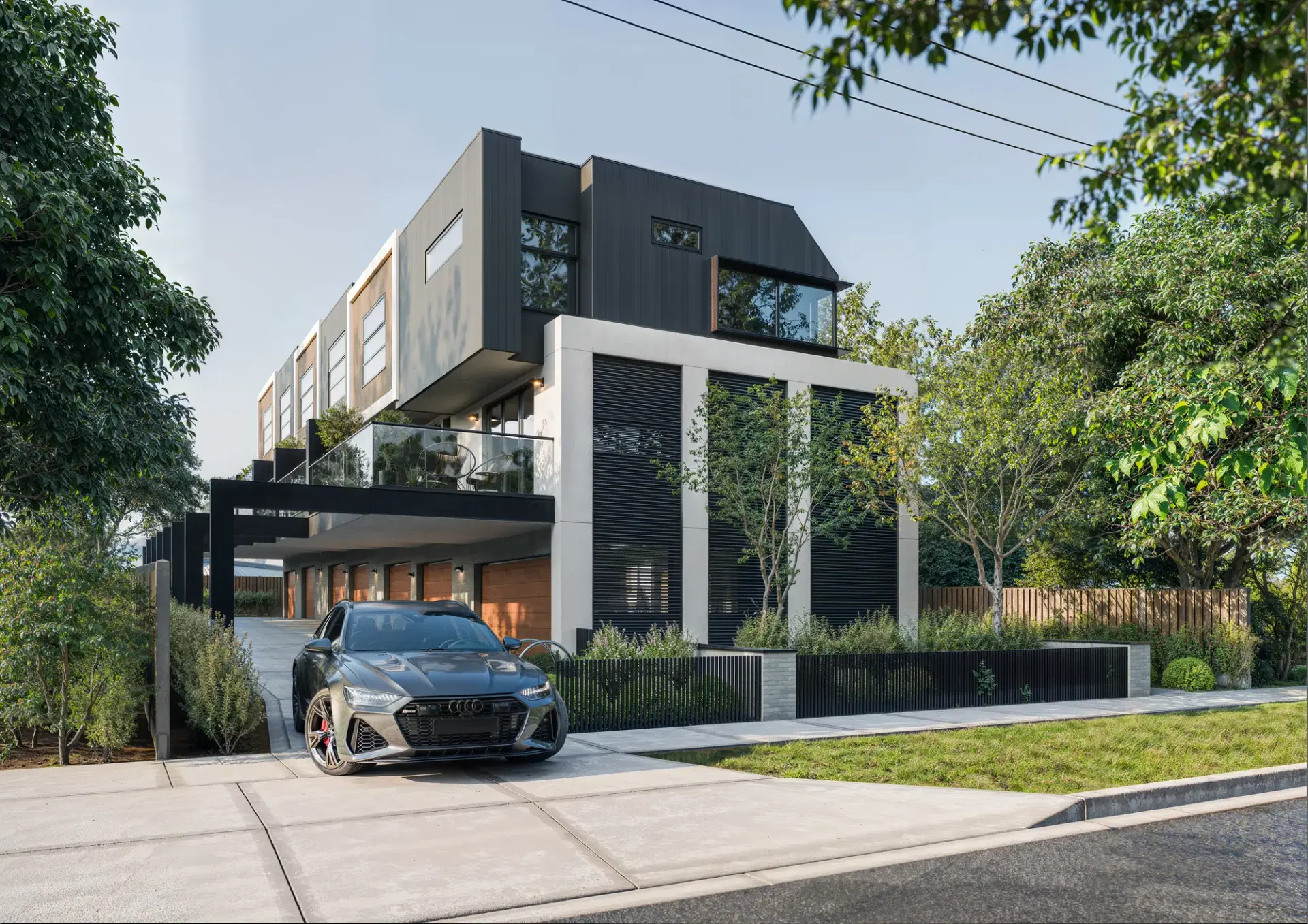 675 Stud Road, Scoresby — facade in charcoal cladding and white render above undercroft parking