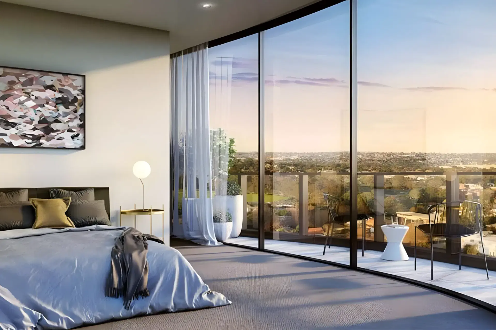 Box Hill Apartments — bedroom opening to a balcony with a wide outlook at sunset