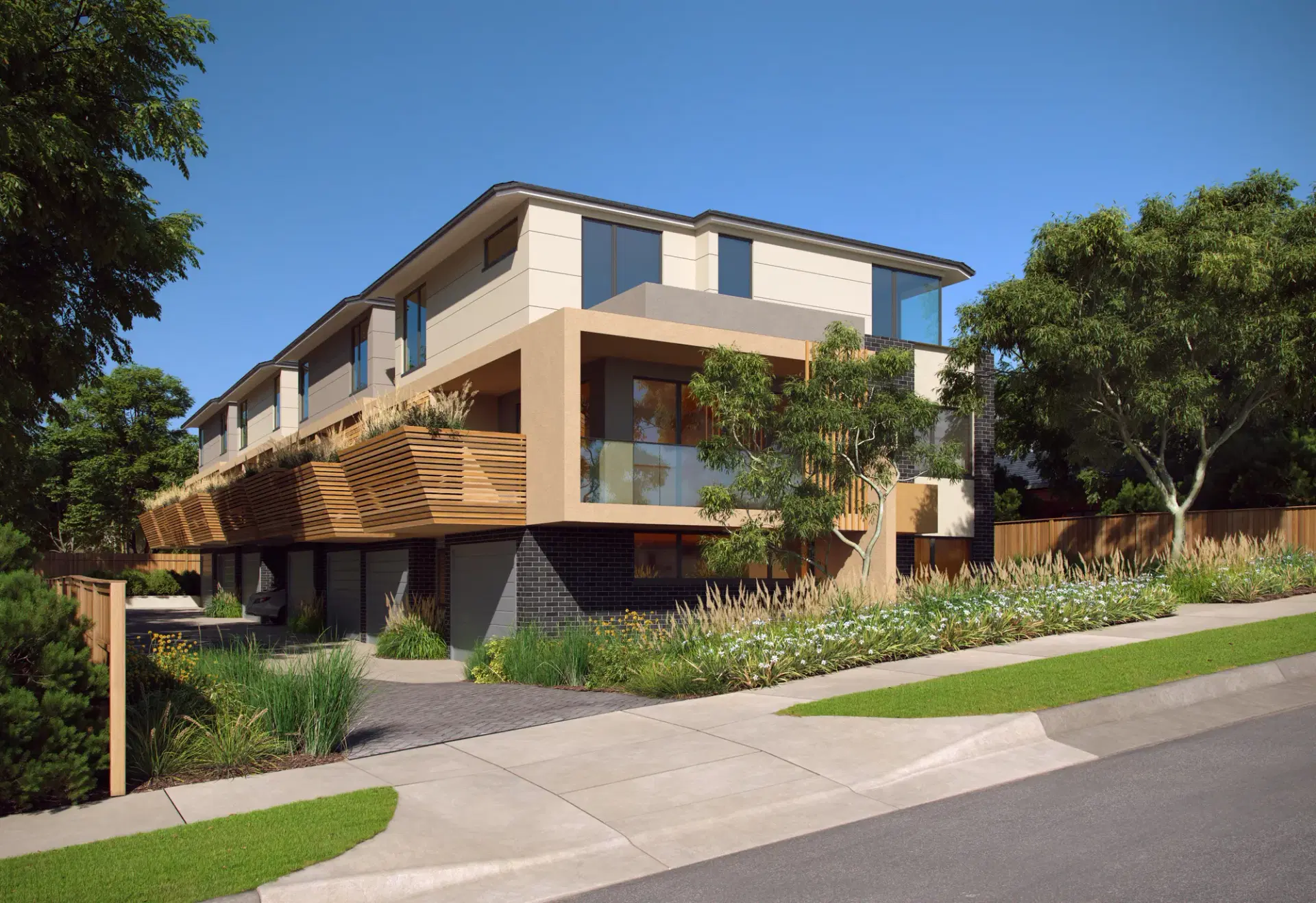 Timber-battened facade of the John Street apartments in Lilydale behind deep planted garden beds