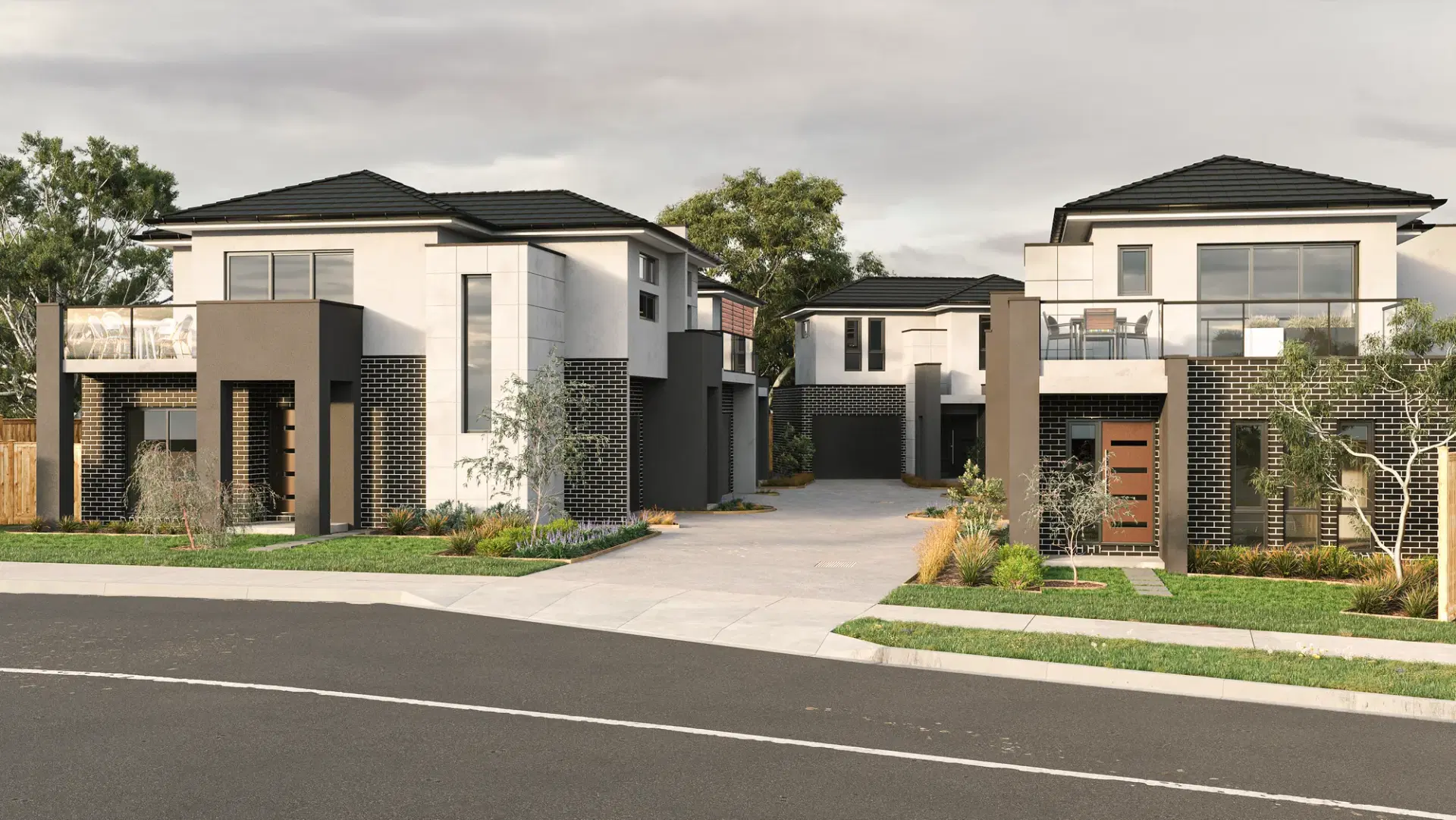 Two double-storey homes on Station Street, Ferntree Gully, in pale render and dark brick with separate driveways